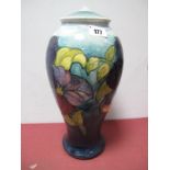 A Moorcroft Pottery Table Lamp, painted in the 'Anemone' pattern against a shaded blue ground,