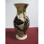 A Moorcroft Pottery Vase, painted in the Butterfly pattern against a cream ground, designed by