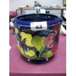 A Moorcroft Pottery Planter, painted in the Hibiscus pattern against a blue ground, impressed and