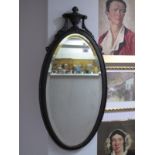 A XIX Century Cast Iron Oval Shaped Mirror, decorated with an urn, beadwork decoratio9n, bevelled