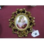 A Late XIX Century Continental Porcelain Oval Plaque, painted with a portrait of a boy, signed