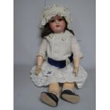 An Early XX Century Porcelain Headed Doll by Armand Marseille of Germany, head stamped '390, DRGM