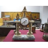 A XIX Century French Gilded Brass Mantel Clock, with a finial top, lyre mounts, enamel dial, (