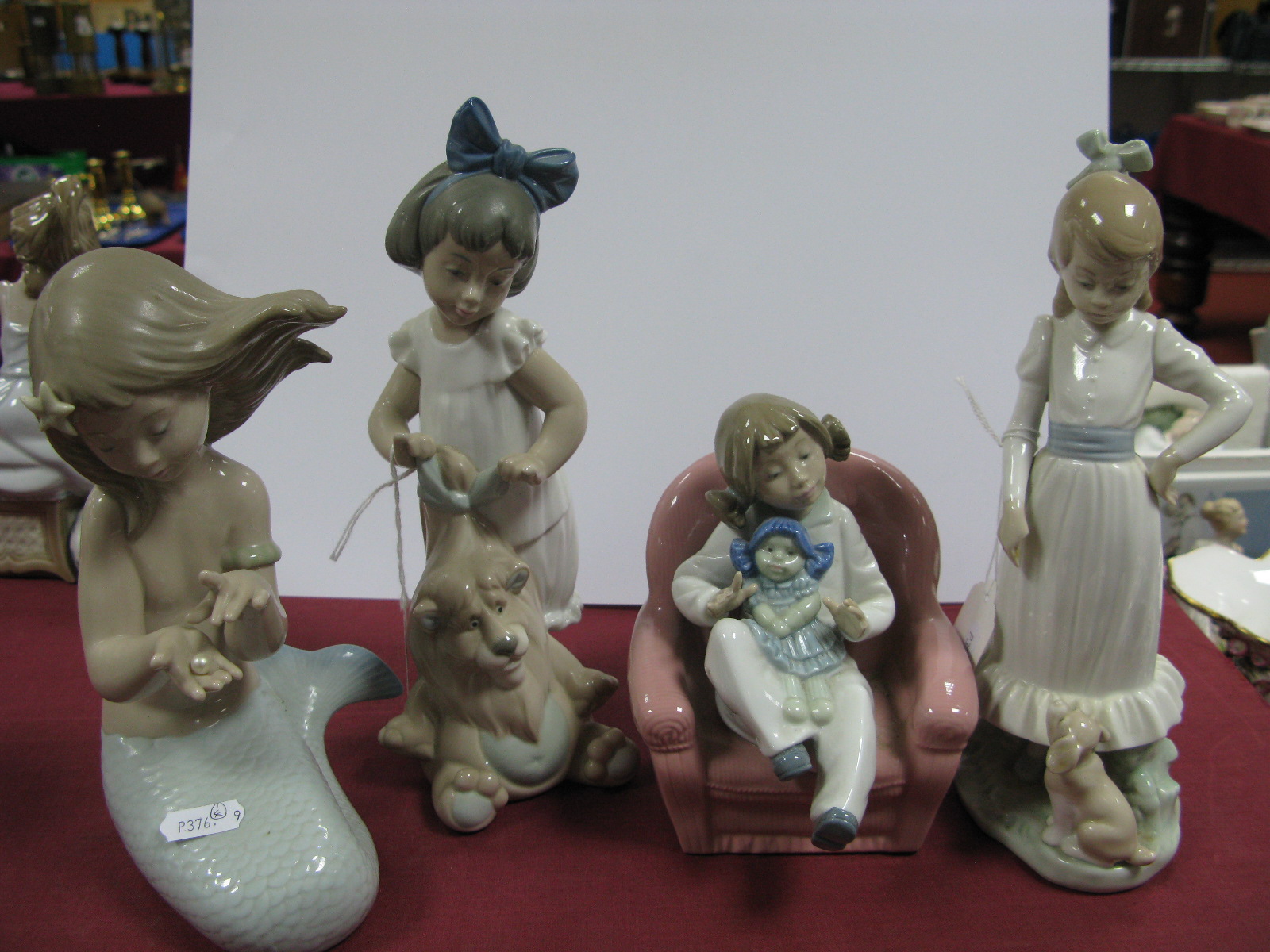 Nao Figurines - mermaid, girl by lion, girl by dog, girl seated. (4)
