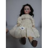 An Early XX Century Porcelain Headed Doll, stamped 'Made in Germany Floradora, AO½M', sleepy eyes