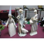 Lladro Pottery Lady Holding Hen, C-15F; Geese Feeder, H-31M and (damaged) Magician, O-270. (3)