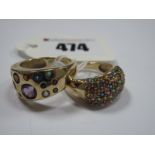 Two Modern 9ct Gold QVC Dress Rings, multi coloured set (stone missing). (2)