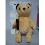 A Modern Steiff Jointed Sooty Bear, #663932, yellow, 30cm high, Certified No 97, boxed.