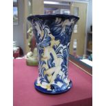 A Moorcroft Pottery Vase, painted in the 'Trial' Florian Nymph design against a cream ground,