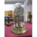 An Early XX Century German Gilded Brass Over Mantel Clock, with circular dial, supported by columns,