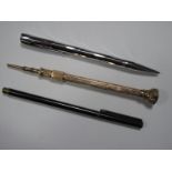 A Decorative Sliding Pencil, with hardstone inset shield finial, overall length 13.3cm; two pens. (