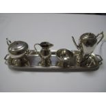 A Miniature Hallmarked Silver Four Piece Tea Set, Birmingham 1937, on an elongated twin handled