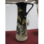 A Moorcroft Pottery Jug Vase, painted with a 'Trial' design of fuschia against a cream and black