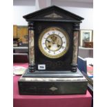 A XIX Century Black Slate Mantel Clock, with enamel dial, Roman numerals half round columns,