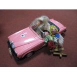 A Pink Barbie Rolls Royce, a Barbie doll and two Pelham Puppets.