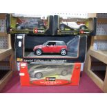 Four Diecast Model Cars, by Burago, Maisto, (1:18th/1:24th scale) including Burago #34063 Aston