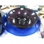 A Purple Glass Bowl, blue glass rimmed bowl and one other glass bowl.