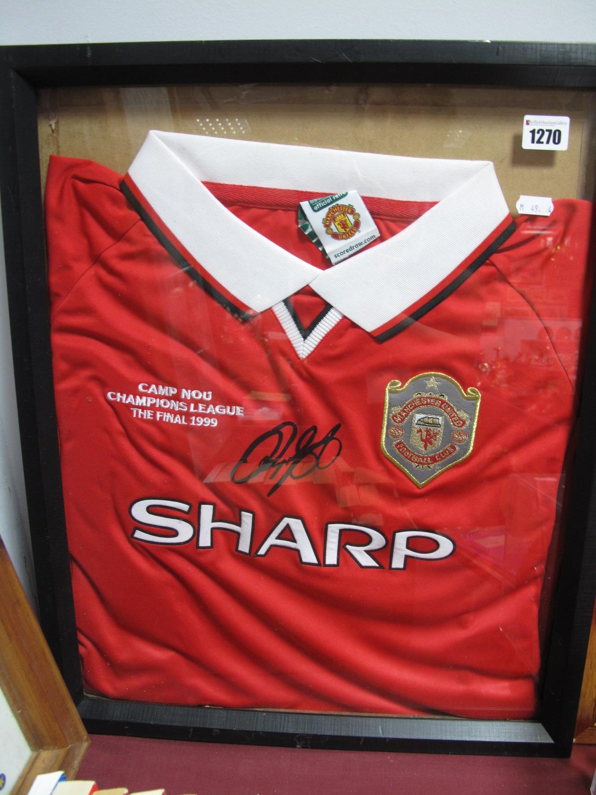 A Manchester United Official Retro 1999 Champions League Shirt. (framed).