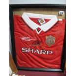 A Manchester United Official Retro 1999 Champions League Shirt. (framed).