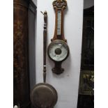 An Early XX Century Oak Aneroid Barometer, with C scroll decoration together with an early XIX