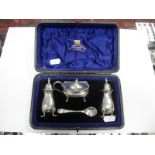 A Hallmarked Silver Three Piece Cruet Set, Birmingham 1905, each of plain form raised on four pad