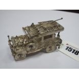 A Novelty Miniature Filigree Model of a 4 x 4 Vehicle, indistinctly stamped.