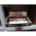 A Golotta Piano Accordion, 26 key, 32 button, cased.
