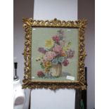 A Gros Point Neddlework Floral Still Life, within a gilt scrolled foliate and pierced frame.