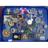 A Collection of Floral Inspired Costume Brooches, and dress clips:- One Tray