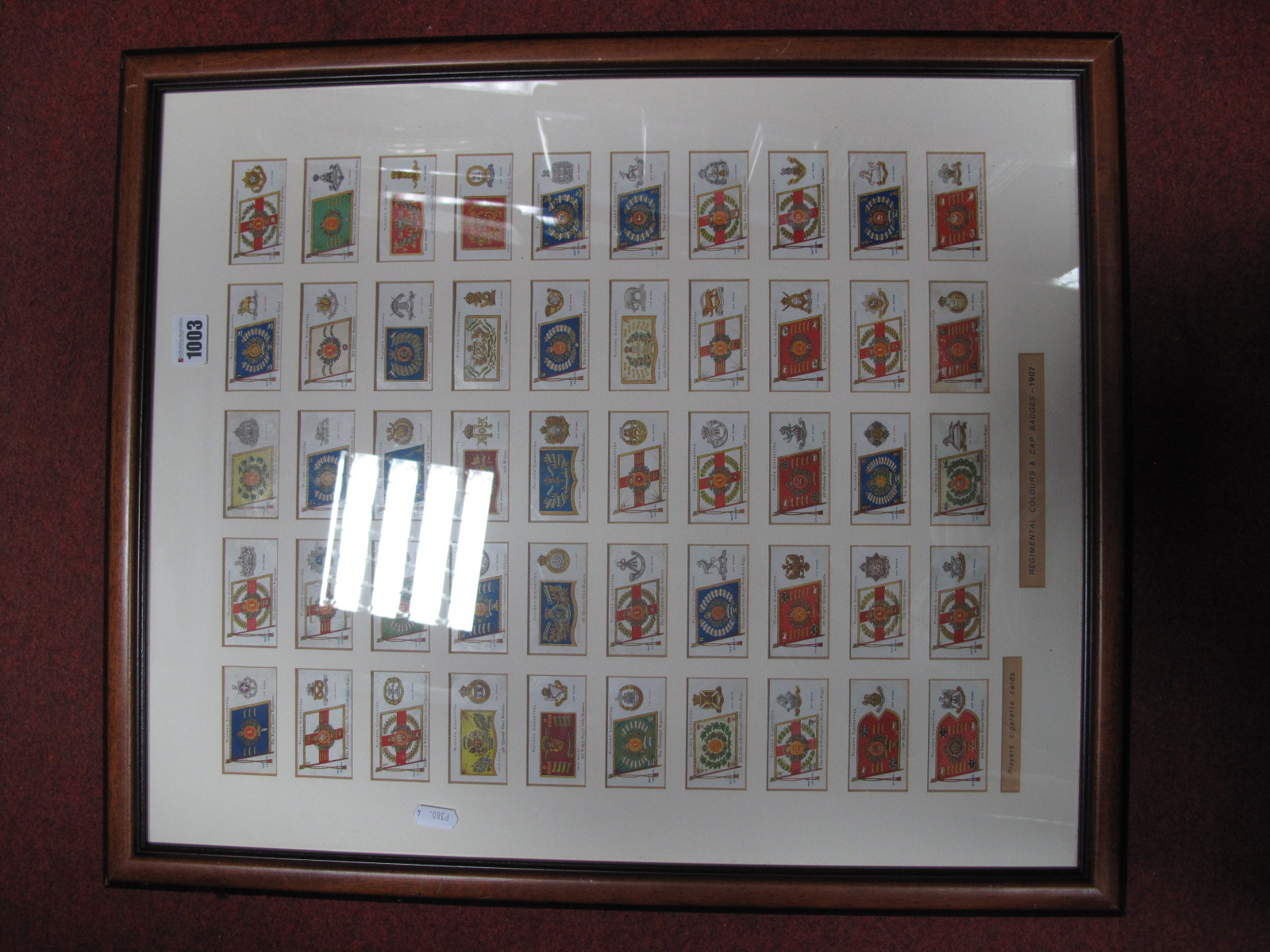 A Set of Fifty Players 'Regimental Colours and Cap Badges 1907' Cigarette Cards, in contemporary