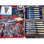 An Italian Cased Plated Canteen of Cutlery, plated souvenir tea spoons, novelty condiments, and