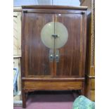 A Chinese Painted Softwood Cabinet, with twin drawers over shelf, brass bar to circular lock