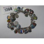 A Curb Link Bracelet, suspending numerous enamel souvenir shield pendants etc.