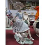 Lladro Pottery Figure Group of Girl Carrying Basket by Playful Puppy, impressed K-26 E 25cm high.
