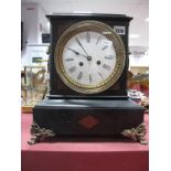 A XIX Century Black Slate Mantel Clock, with stepped cornice, circular enamel dial with Roman