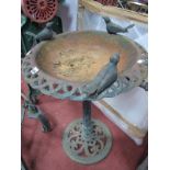 A Cast Iron Bird Bath, with three cast birds on pierced rim, on a circular pierced base.