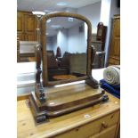 A Victorian Mahogany Toilet Mirror, flattened arch mirror on shaped supports, stepped base.