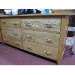 An Ash Sideboard, with six small drawers and bar handles.