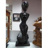 Carved Hardwood Figure of Stylized Lady, on rectangular plinth 64cm high.