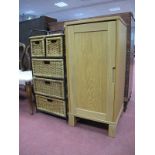 An Oak Cabinet; together with wicker baskets, on black stand. (2)