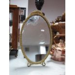 A Mid XX Century Gilt Painted Freestanding Oval Dressing Table Mirror.