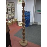 A Hardwood Indian Standard Lamp, circa mid XX Century, heavily carved with animals amongst