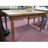 A XX Century Rectangular Shaped Dining Table, on tapering legs.