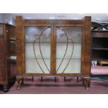 a 1920's Walnut Art Deco Style Display Cabinet, with a low back, glazed door, on cabriole legs,