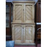 A XIX Century Pine Cupboard, with stepped pediment, slope flanked panelled doors to upper and