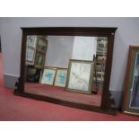 An Early XX Century Walnut Overmantel, with reeded sides, bevelled glass with shaped corner