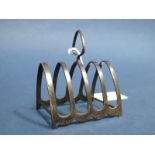 A Hallmarked Silver Five Bar Toast Rack, Henry Matthews (marks rubbed), Birmingham 1914, of arched