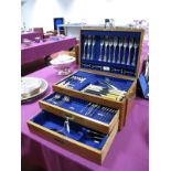 An Oak Cased Part Canteen of Plated Cutlery, with lift up lid and two drawers, the fitted interior