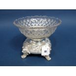 A Decorative WEPCo (WMF Export) Electroplated Mounted Pressed Glass Dish, the shaped circular base