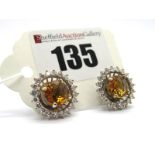 A Pair of Large Modern Citrine and Diamond Set Cluster Earstuds, each central allover faceted